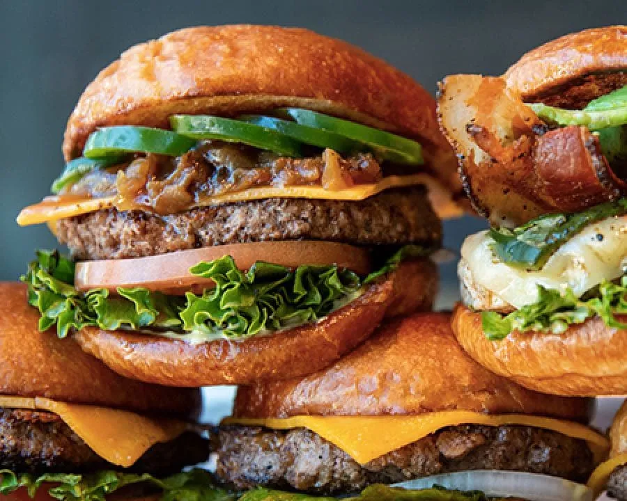 Stack of several types of Hopdoddy burgers