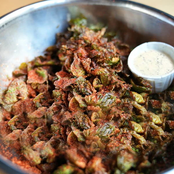 Brussels leaves tossed with bbq seasoning & served with HD ranch.
